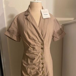 Taupe dress NWT size medium. In perfect condition diction never worn.
